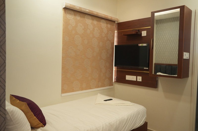 Classic Single Studio showing the roller blind and television panel