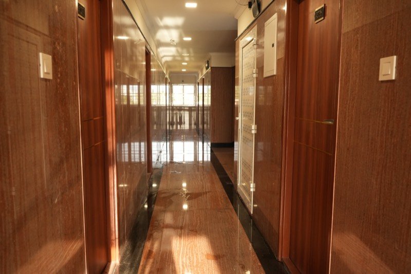 Guest-floor corridor with teak doors